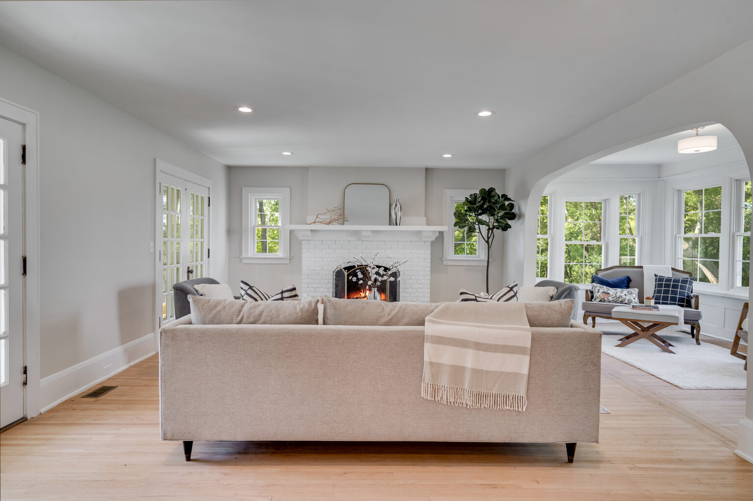 Luxury living room with sectional sofa and natural light in a Minnesota custom home